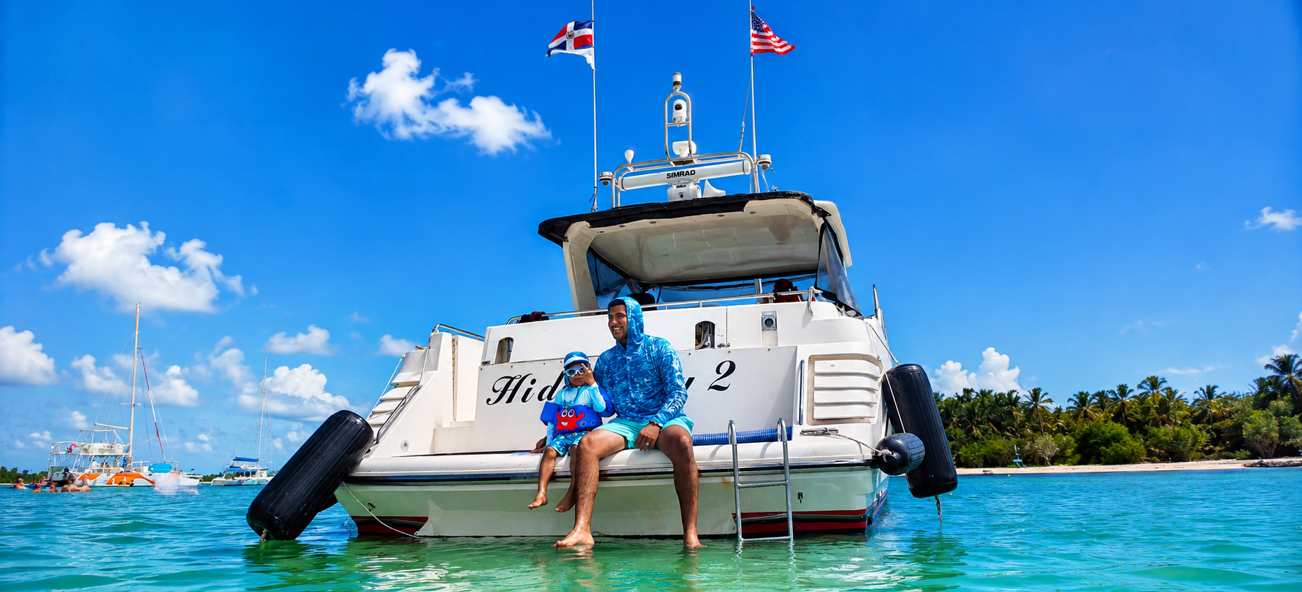 Front view of a luxury private yacht charter in Punta Cana with guests enjoying the Caribbean Sea.